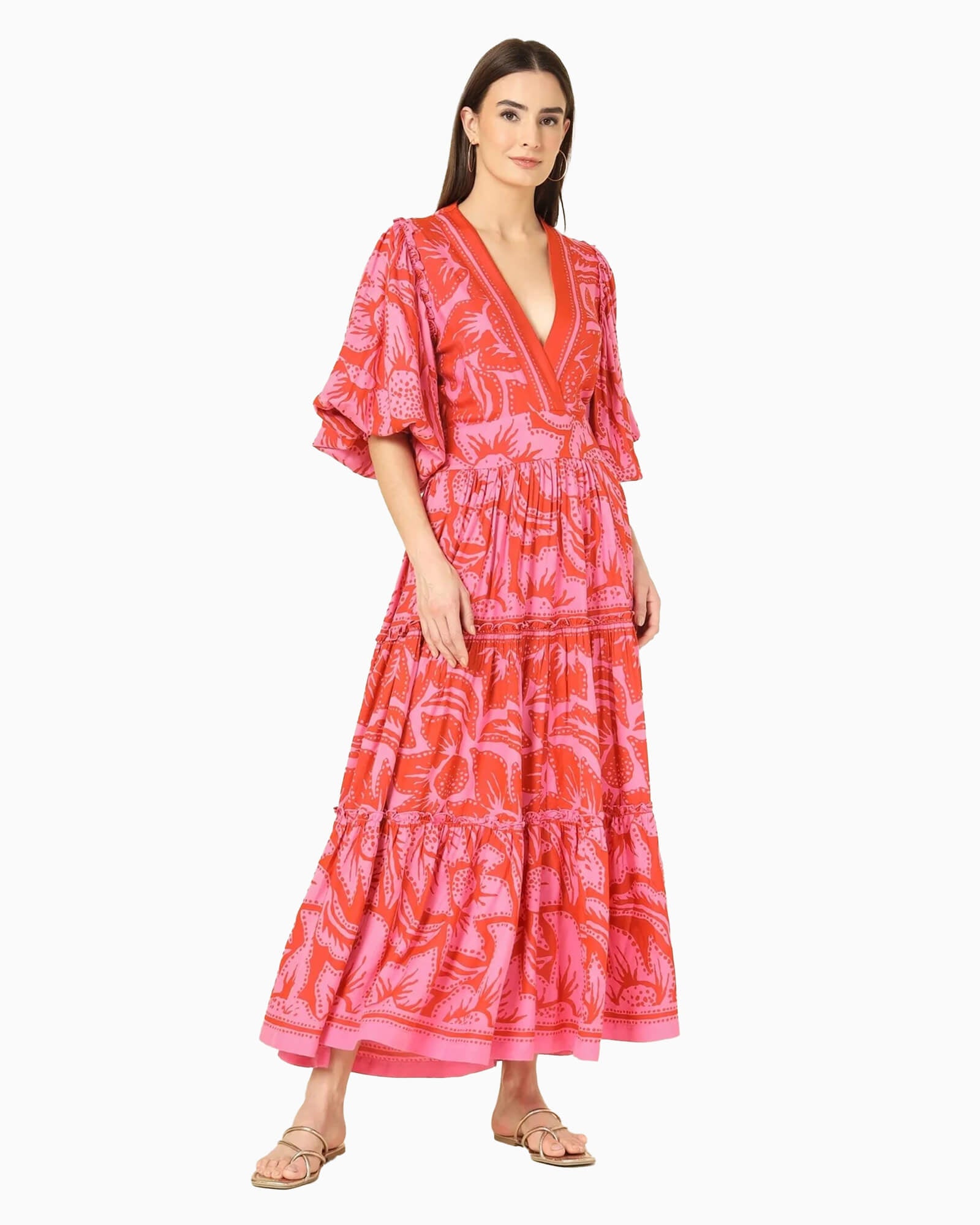 Model wearing pink and red printed maxi dress.